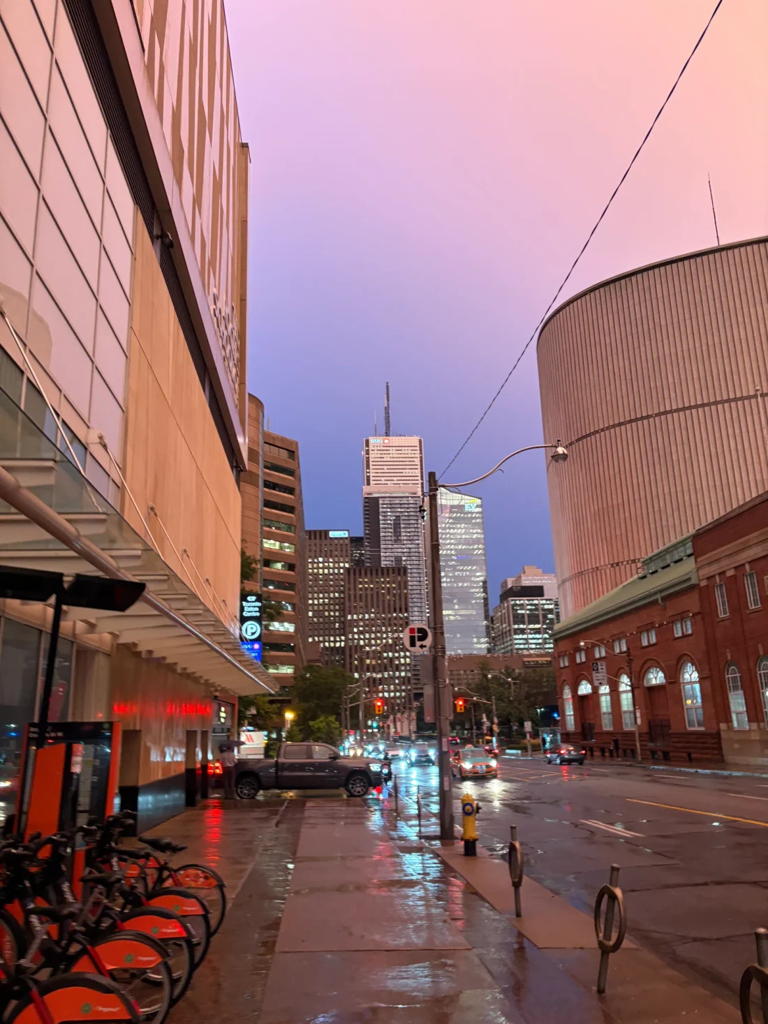 A rainy city street at dusk