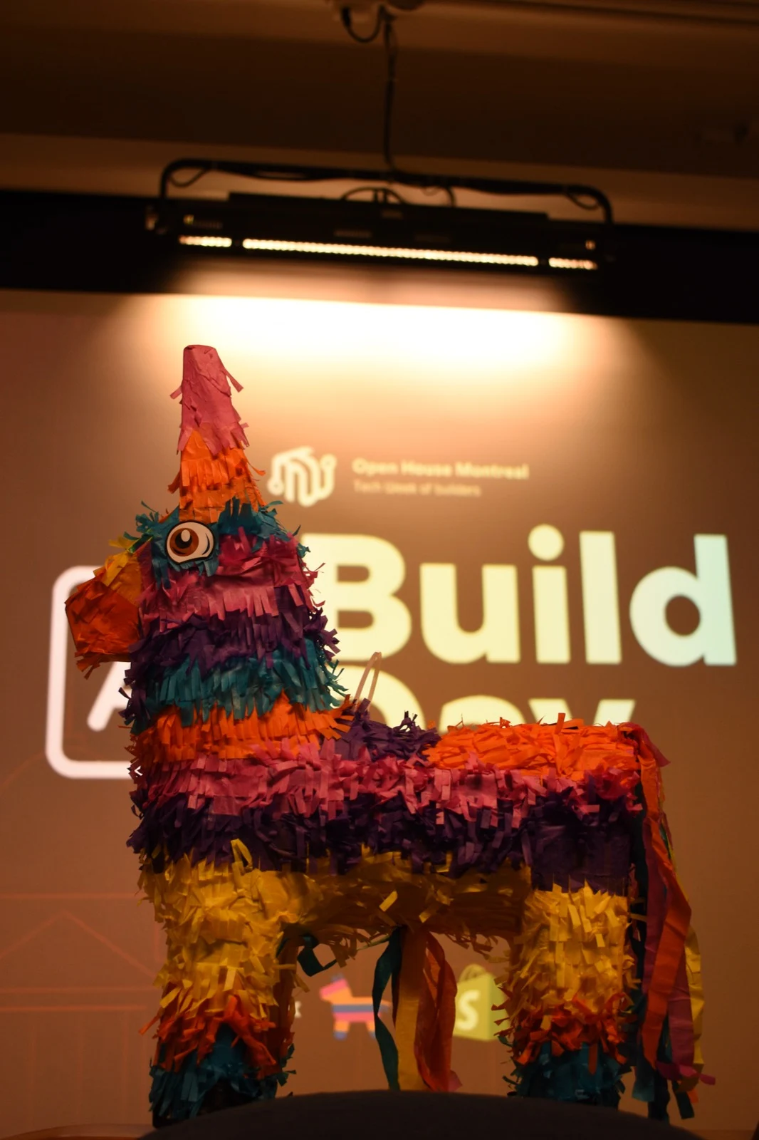 A colorful donkey piñata at a Build Day event